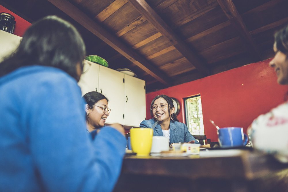 A team leader in conversation with local staff.