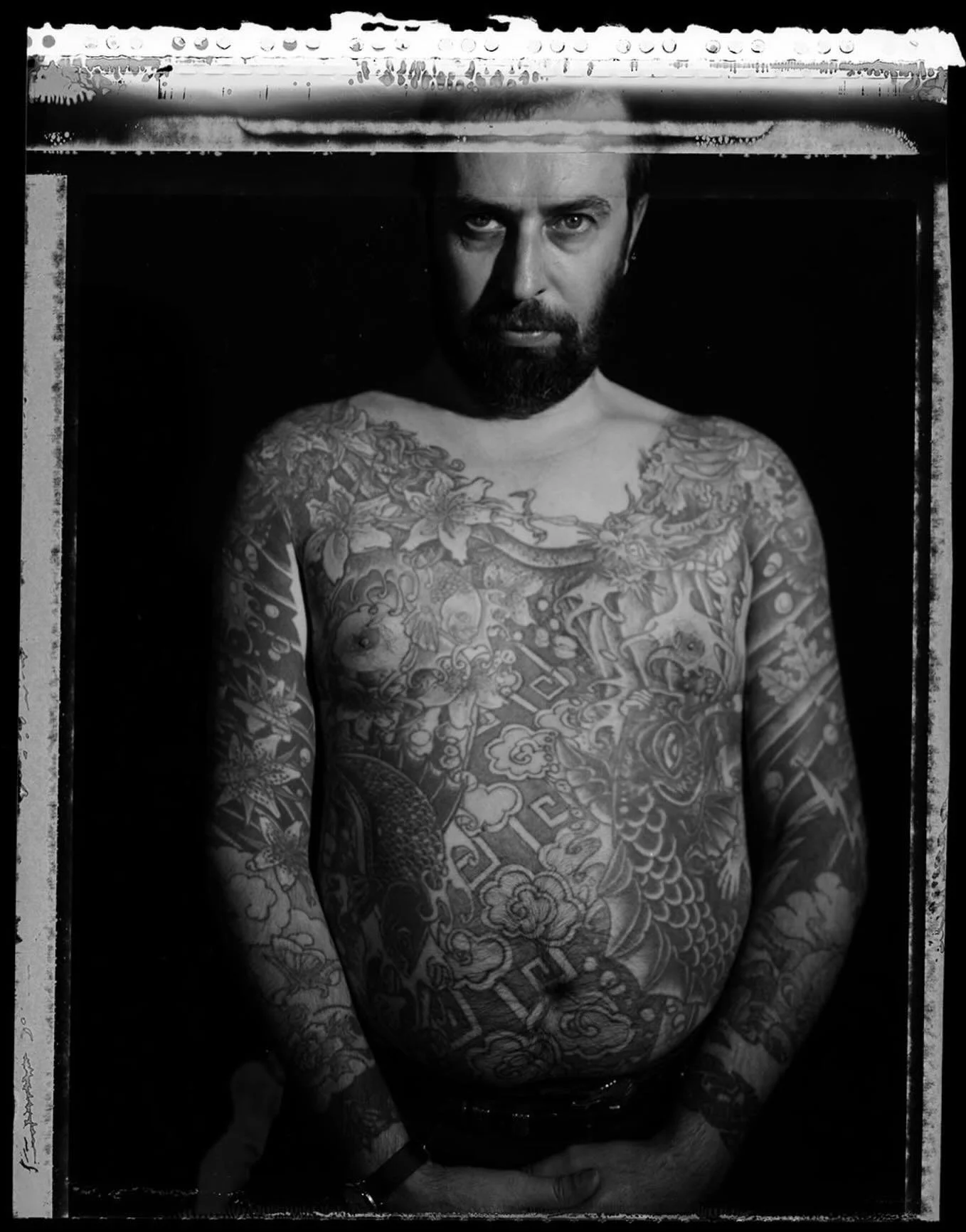 Western/Japanese style body suit by my dad, Mike Bakaty. Done in the early 80s in the old shop at 295 Bowery. Not a lot of people were doing this style of work at the time. Real tattoo renaissance stuff. Photo is a self portrait by Tom McGovern. @mcg