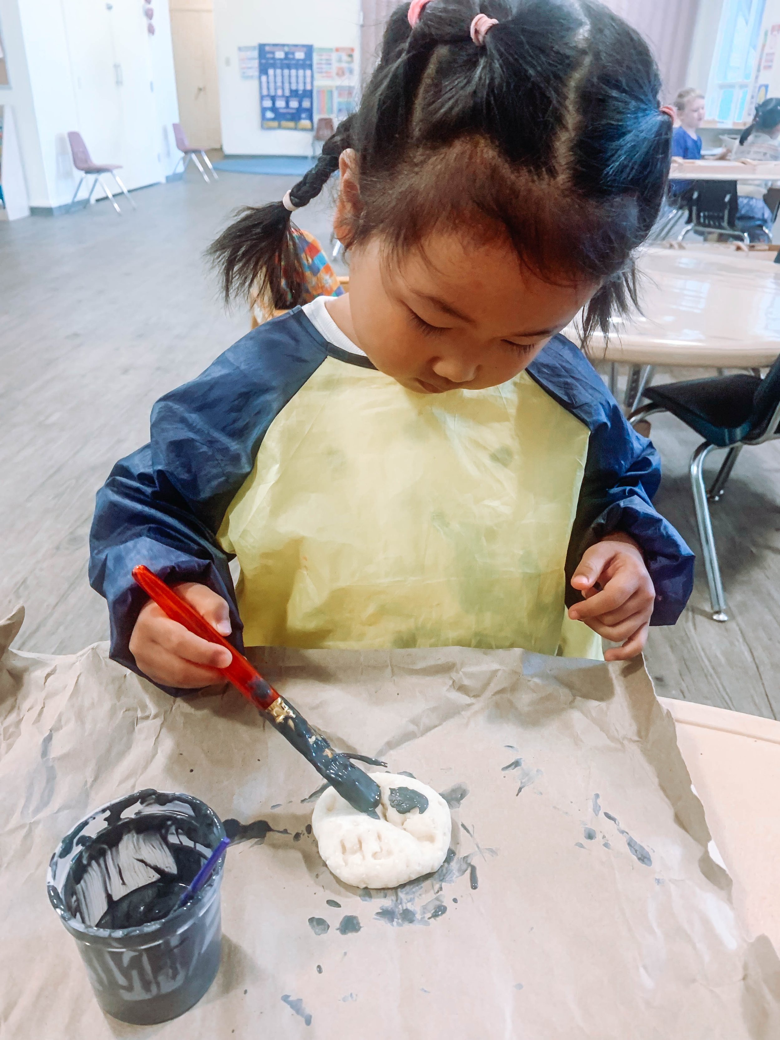 girl playing with paint