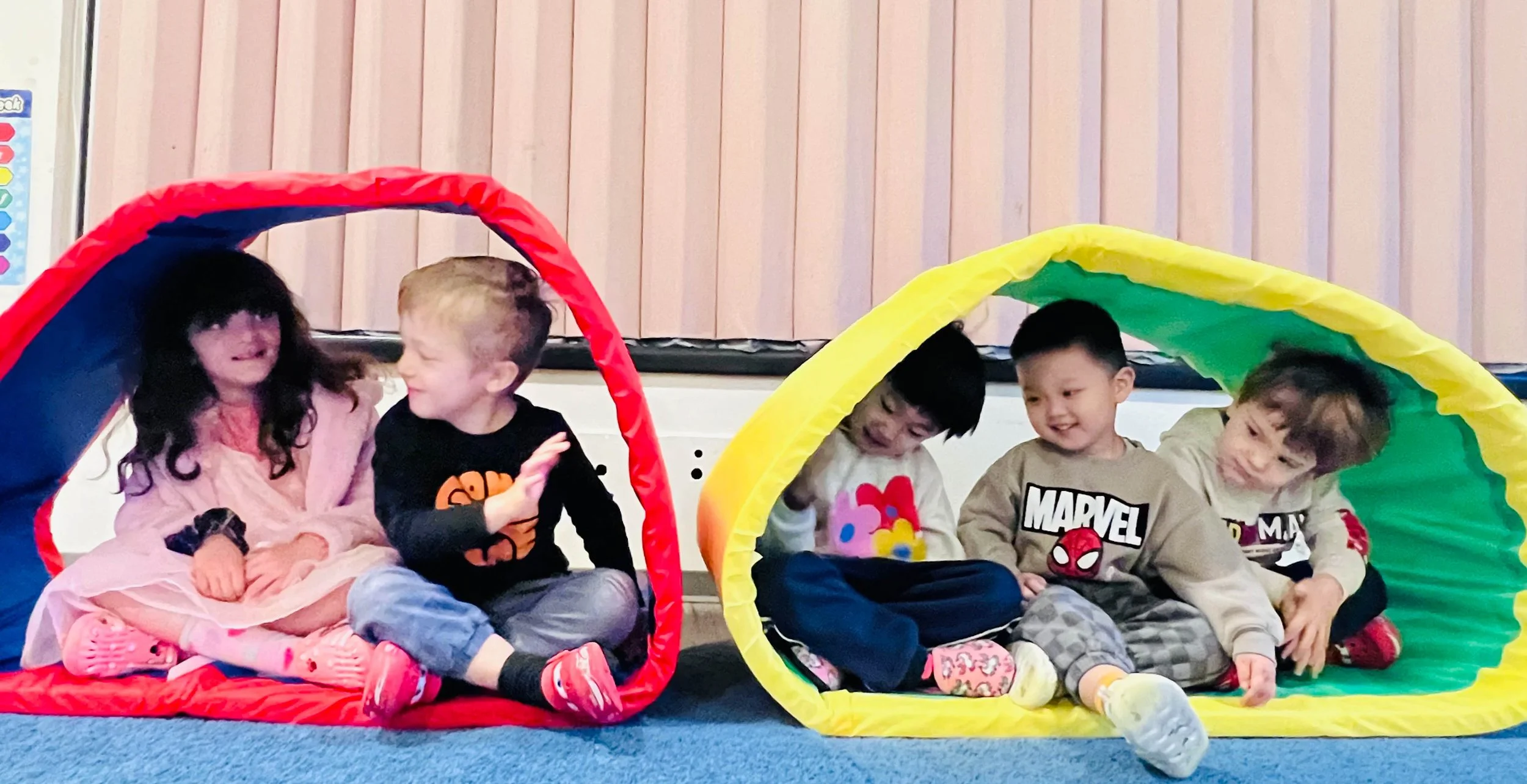 A woman using a professional camera to take a photo of a cityscape with branded buildings, cars, and pedestrians.