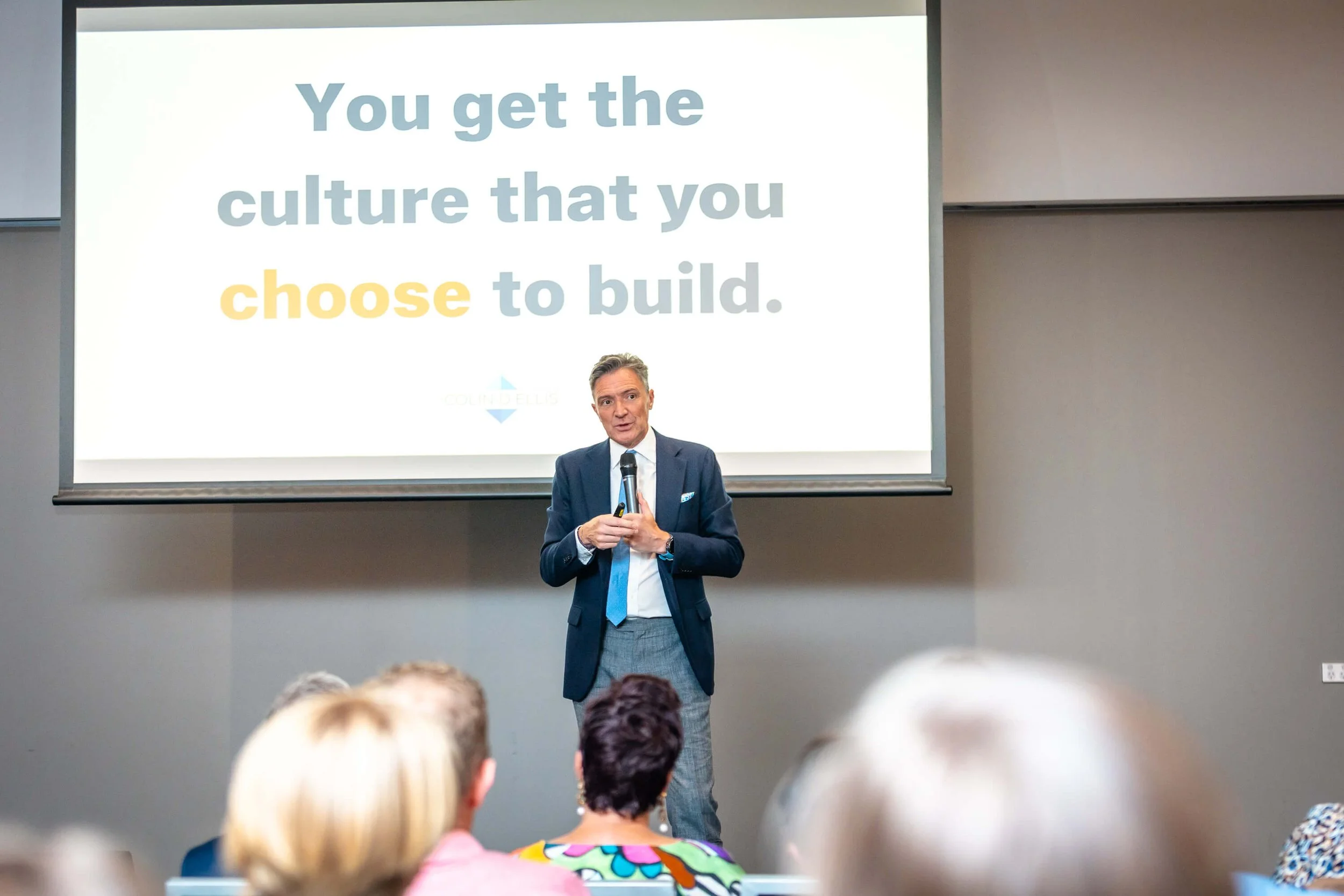 Image shows award-winning culture speaker Colin D Ellis on stage