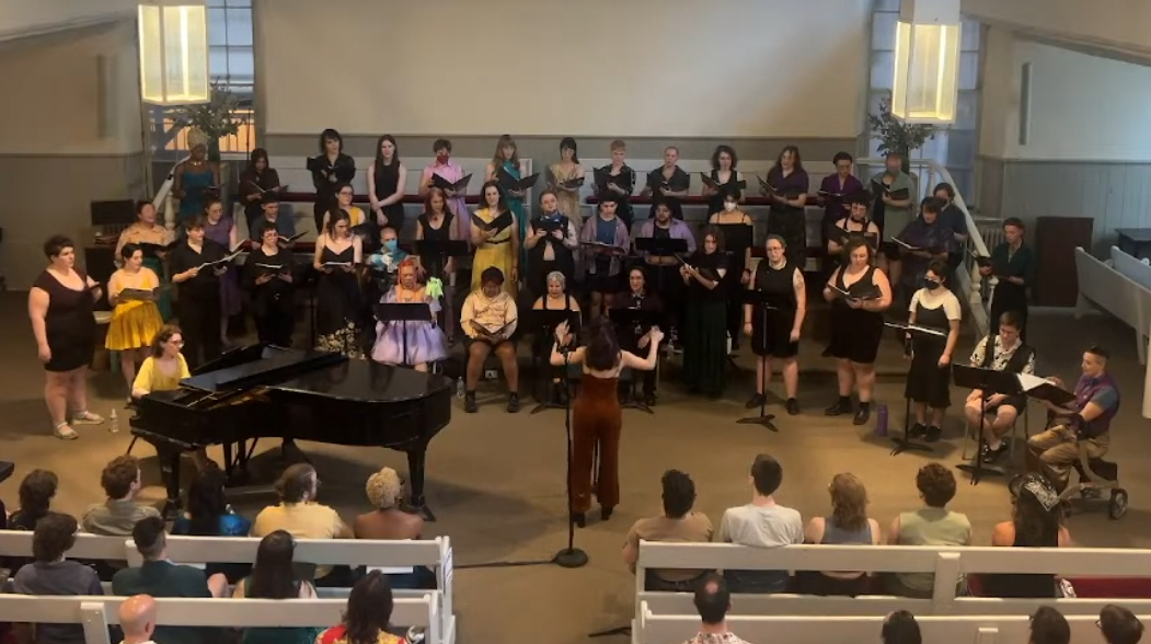 The TRANScend Community Chorale, directed by Hannah Cai Sobel with Molly Fussell accompanying on piano. The choir features over 60 trans & gender non-conforming singers.