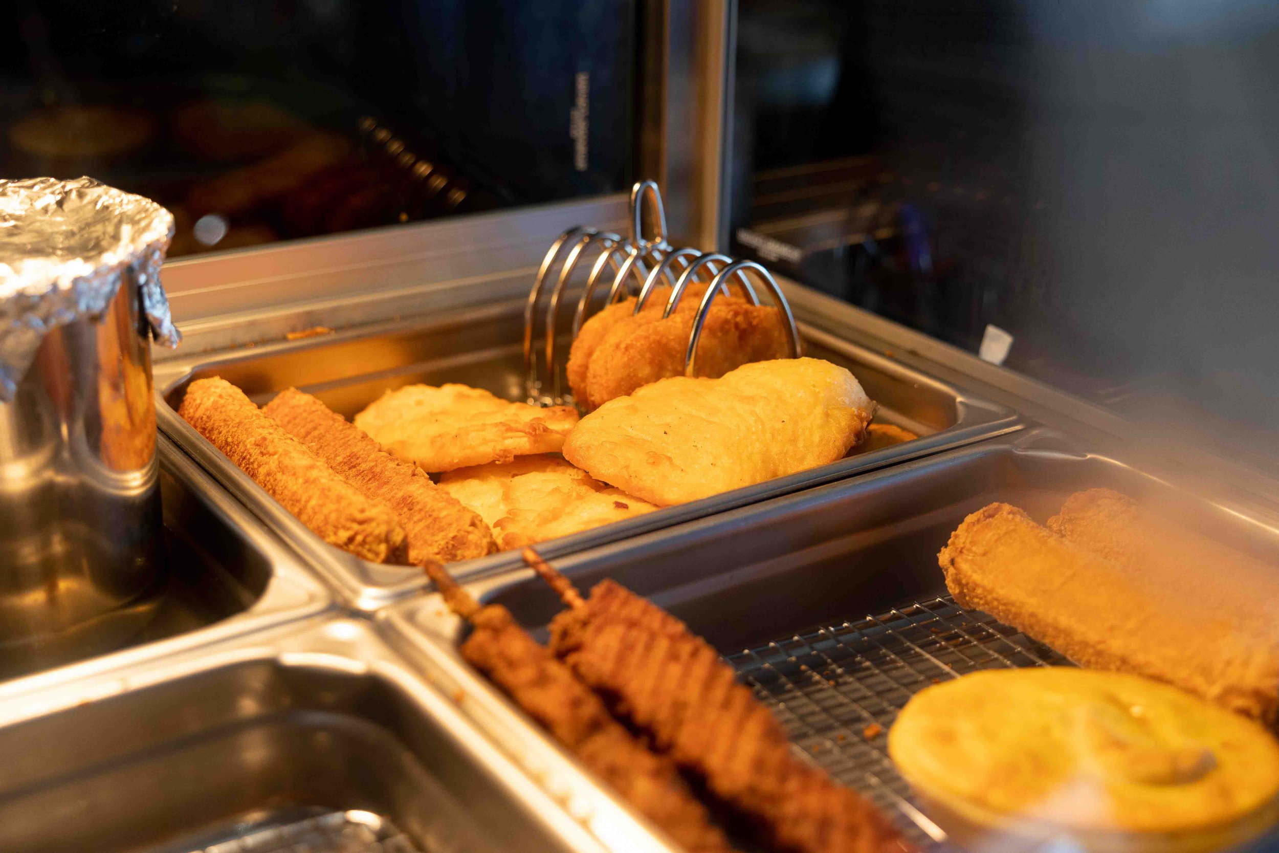 Hot food in the Bain-marie including scallops and hash browns