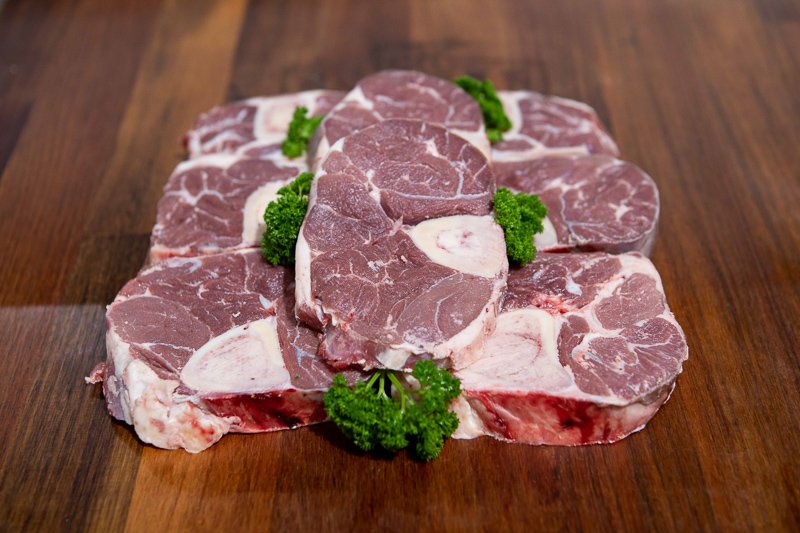 lamb meat on a wooden chopping board