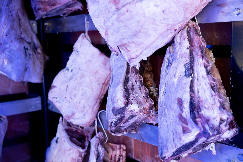 Beef hanging in the dry ageing room