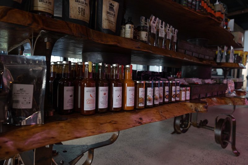 Condiment display shelf. Visible are Beerenberg brand sauce and marinade varieties. 