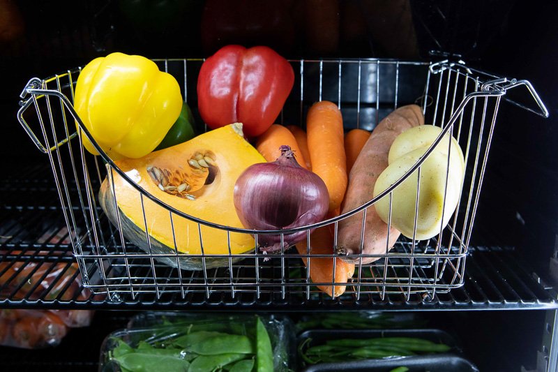 fresh veggies in a basket in the fridge