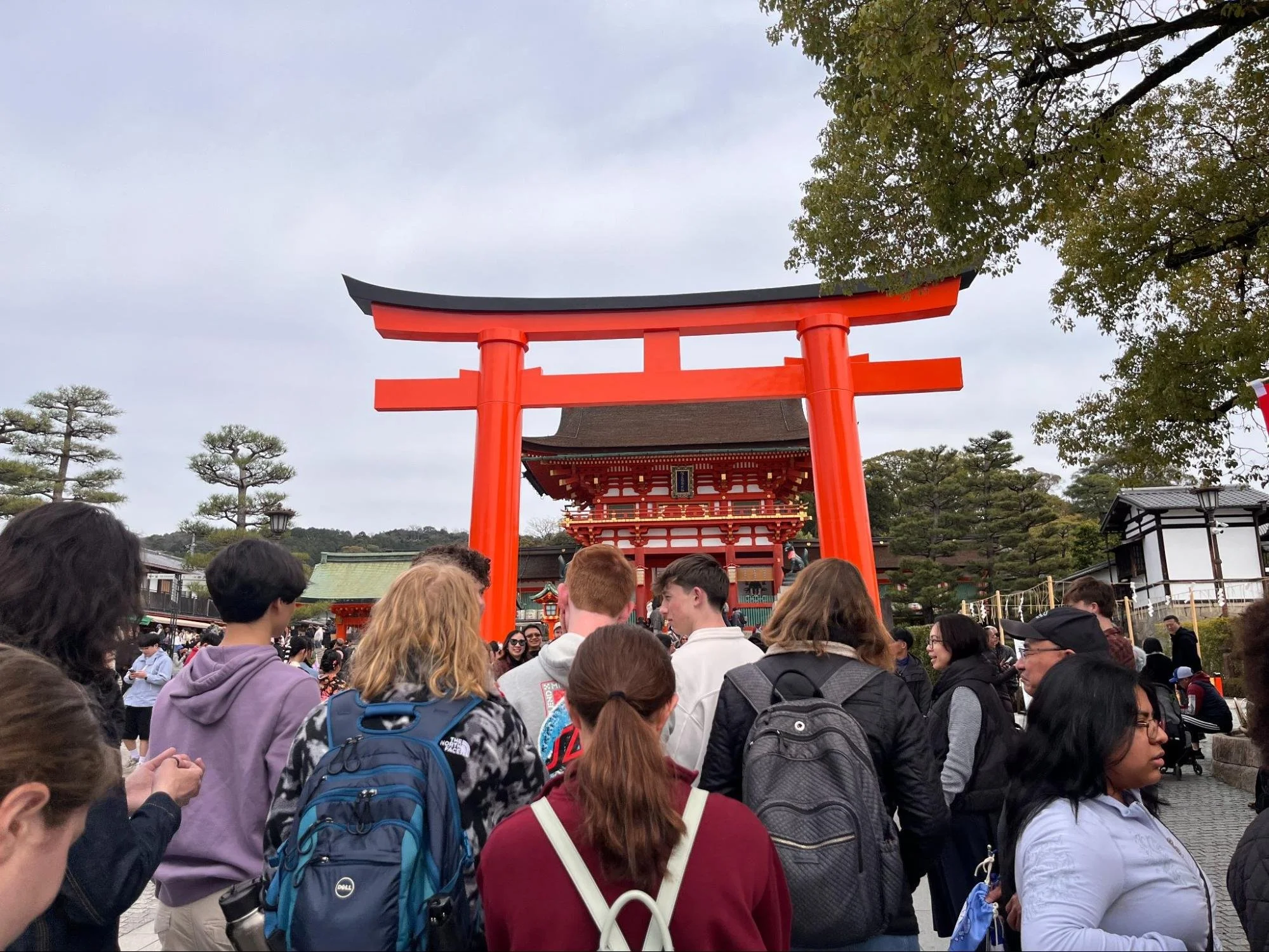 Students walking through a busy Tokyo area, showing urban density and city infrastructure.
