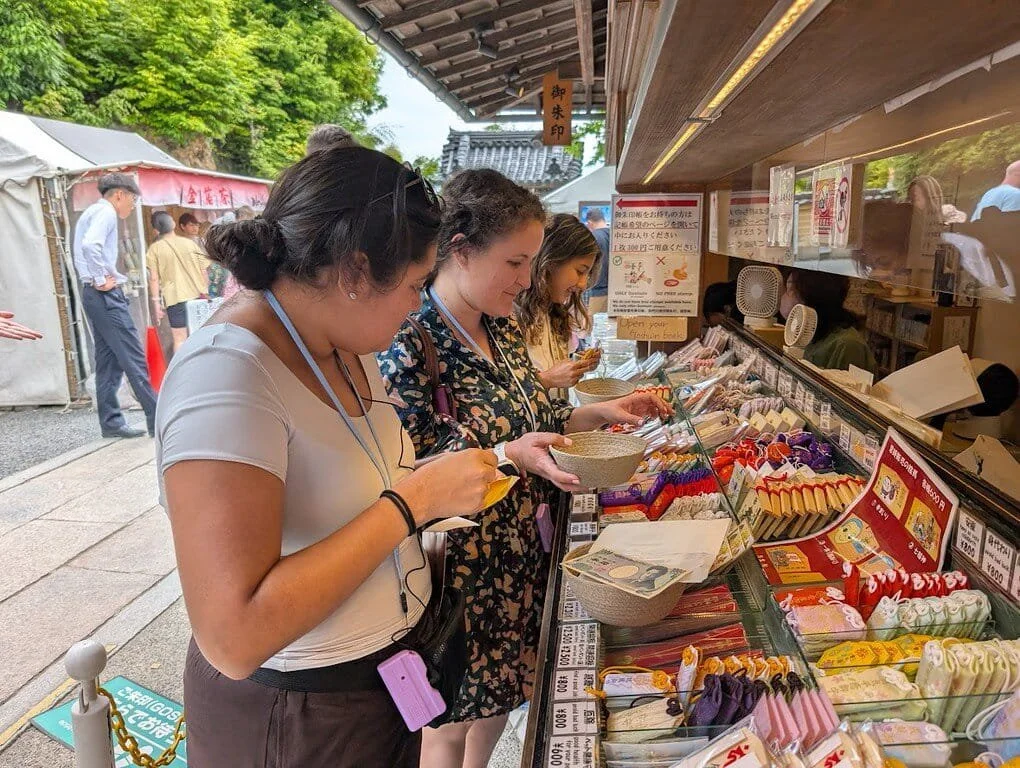 Students visiting a local market in Japan.