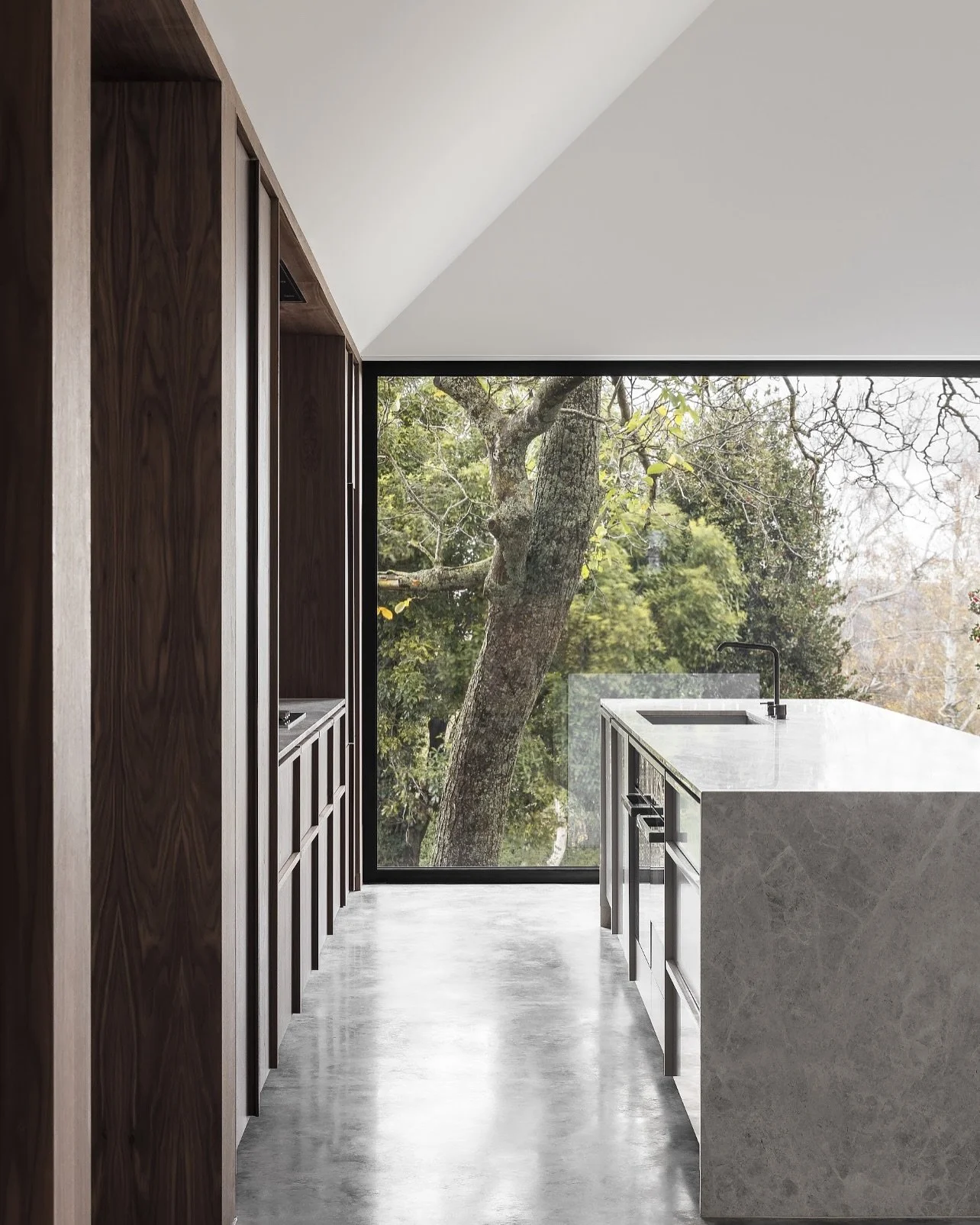 Rooted in nature, The Walnut House draws inspiration directly from the majestic walnut tree on site. Every material was thoughtfully chosen to honour its presence. Warm walnut timber, natural stone and soft finishes that celebrate rather than compete