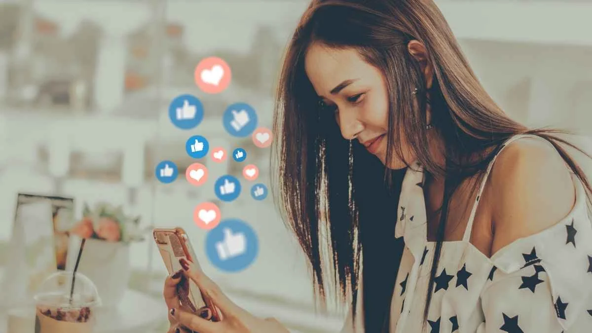Woman using social media on her smartphone with icons floating off the screen