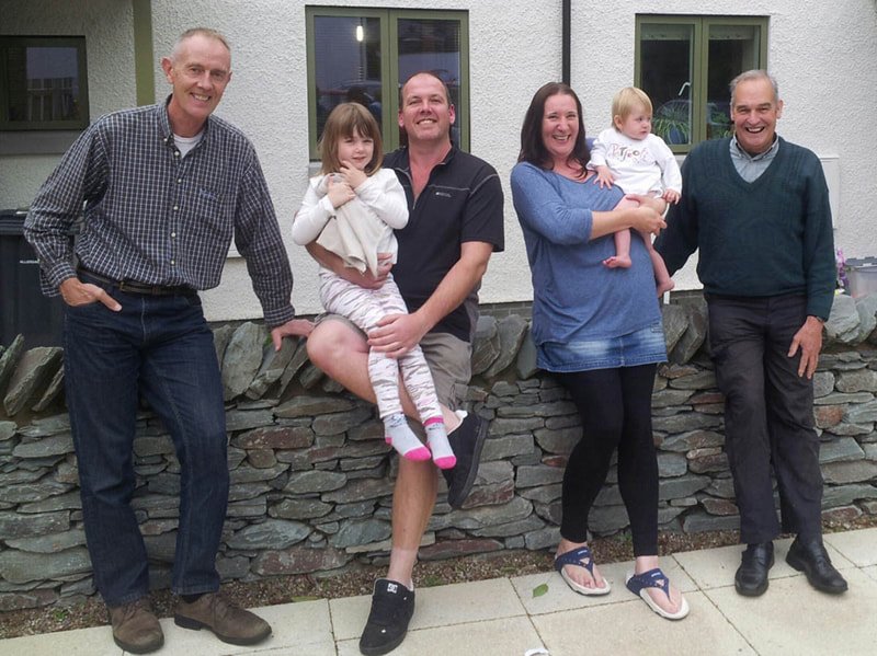New residents Gary and Lucy Wilson and their children, with KCHT board members Andy Lloyd and Bill Bewley