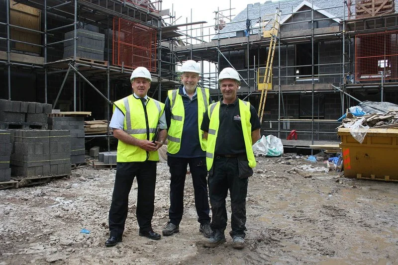 Cumberland Building Society business lending manager Lionel Dobson (left) and site manager Steve Pickering (right) with KCHT treasurer
