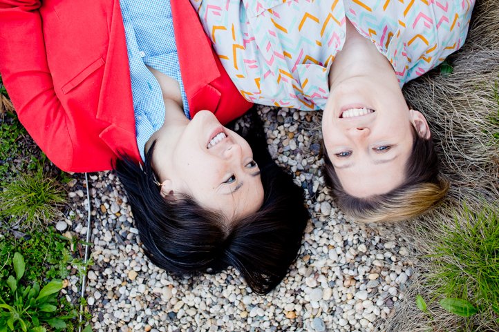 upside down shot of Alice &amp; Catie laying on the ground in a park in brooklyn, NY
