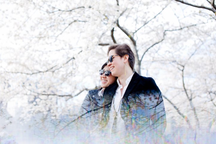 Double exposure effect on photo of alice &amp; catie embracing in front of a tree in bloom in Brooklyn, NY