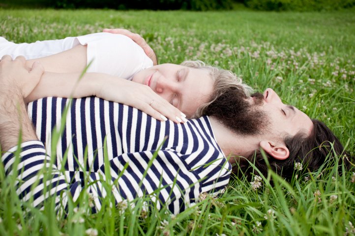 Randy &amp; Kelsey Taylor embrace and lay in their backyard at their home in Hudson, NY