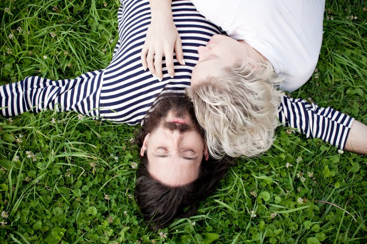 Randy &amp; Kelsey Taylor embrace and lay in their backyard at their home in Hudson, NY