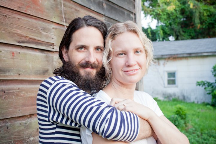 Randy &amp; Kelsey Taylor embrace in their backyard at their home in Hudson, NY