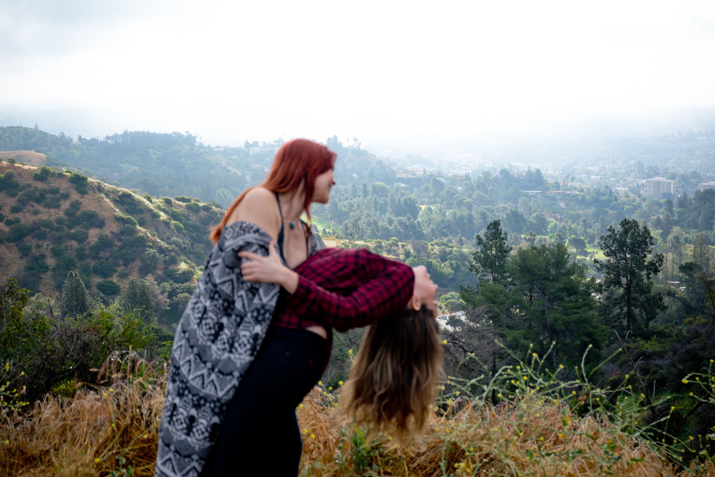 Courtney &amp; Tierney dancing with the hills of Los Angeles in the background