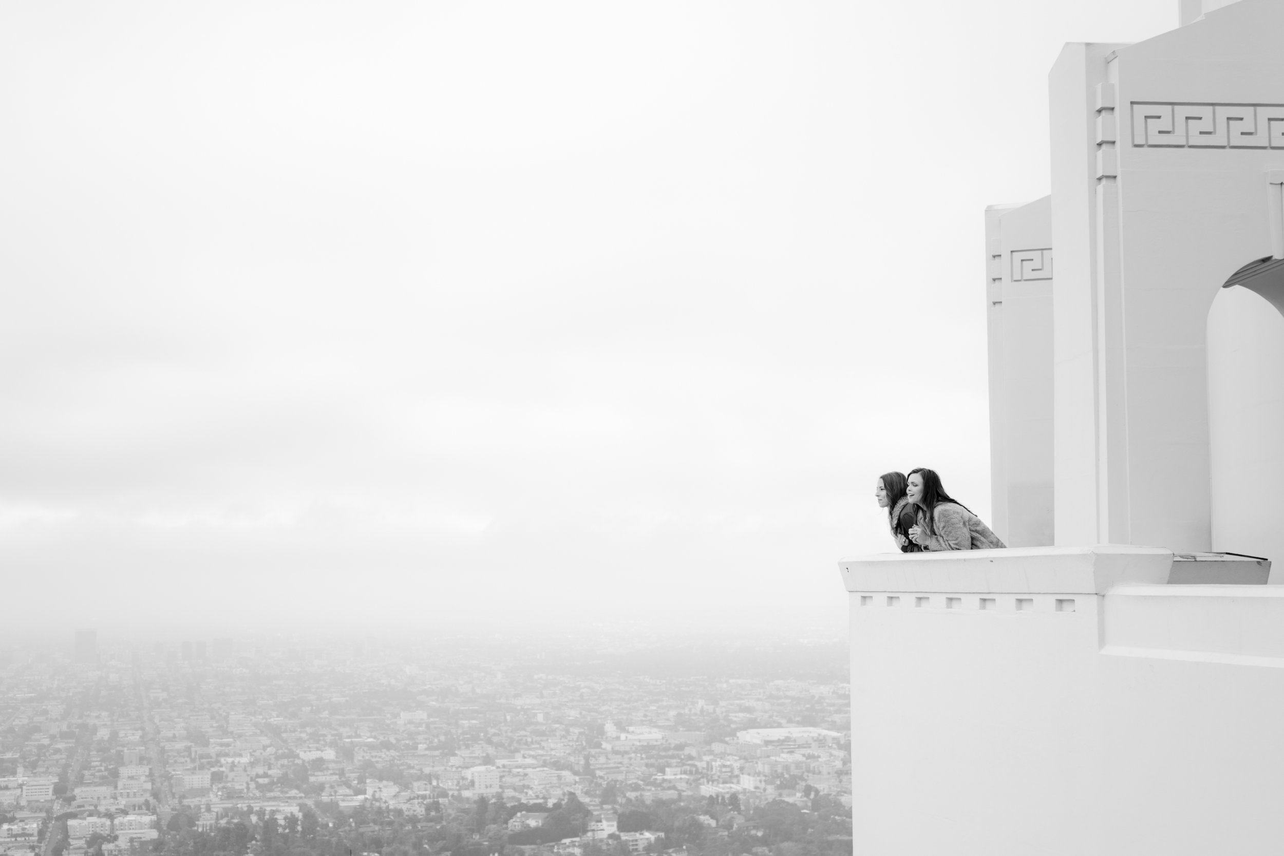 long shot of Grace &amp; Tierney kissing at the Griffith Observatory with LA in the background