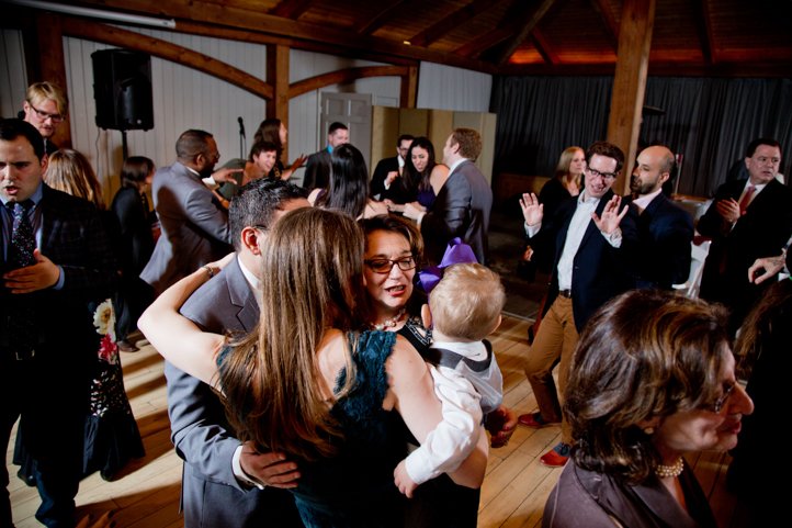 Wedding guests hugging on the dance floor