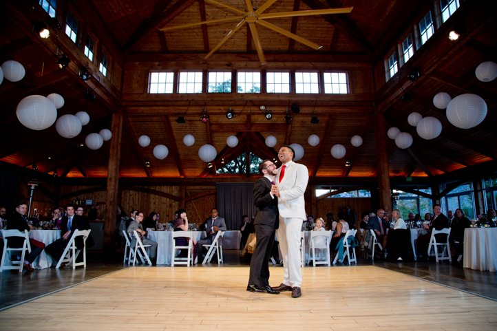 Arthur &amp; Scott laughing on the dance floor at their wedding reception in Hudson Valley, NY