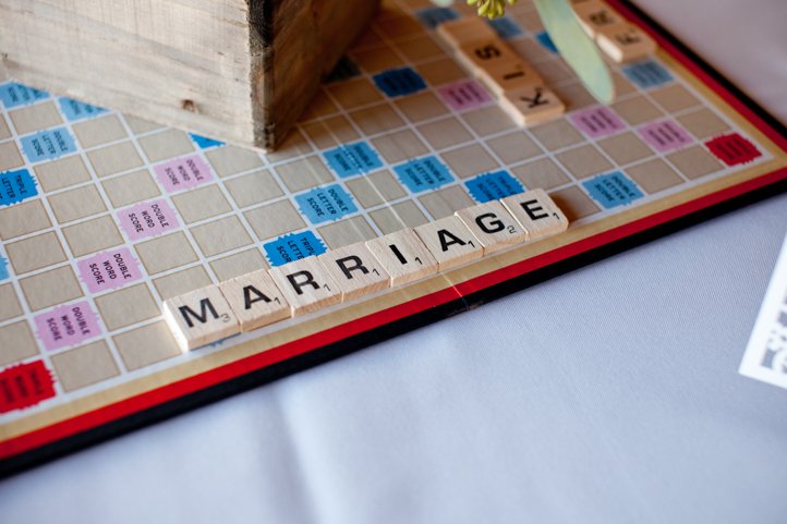 Scrabble board that has "Marriage" laid out