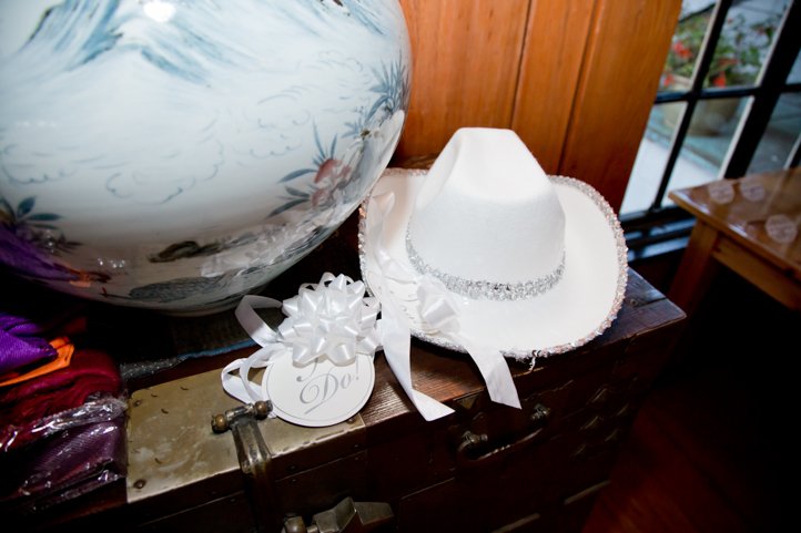 White cowboy hat with button that says "I Do"