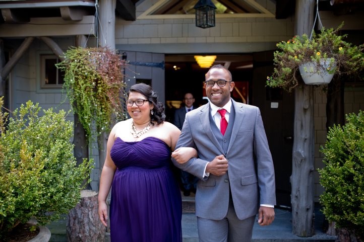 Smiling wedding party walking down the aisle emerging from the cabin in Hudson Valley, NY