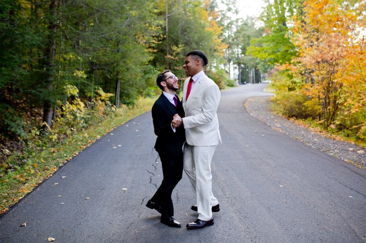 Arthur &amp; Scott dance on a wooded street in the Catskills during autumn