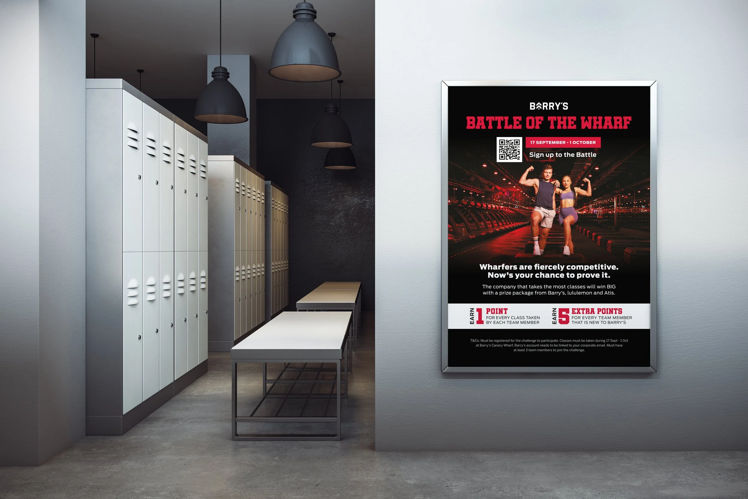 Indoor locker room with white lockers, a white bench, and a large poster advertising a sports event called Barry's Battle of the Wharf featuring a photo of two athletes flexing their arms.