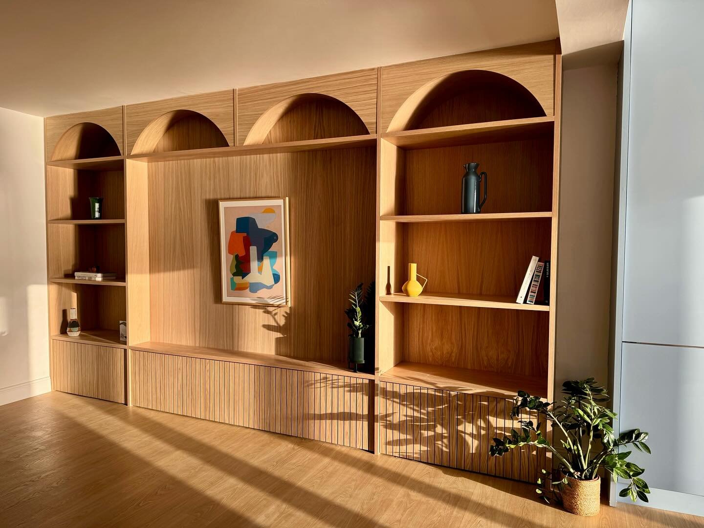 Joinery wall designed to display bespoke pieces with closed storage at the bottom to hide the not so bespoke pieces. &lsquo;Floating&rsquo; by the talented @jenny_belton_art taking centre stage here, purchased from the very sound people at @fiercenic