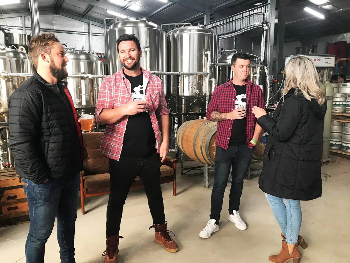 Guests on a guided outdoor brewery tour at Cape Jaffa Wines — learning about craft beer and the unique vineyard-brewery setup from Tom, their head brewer.