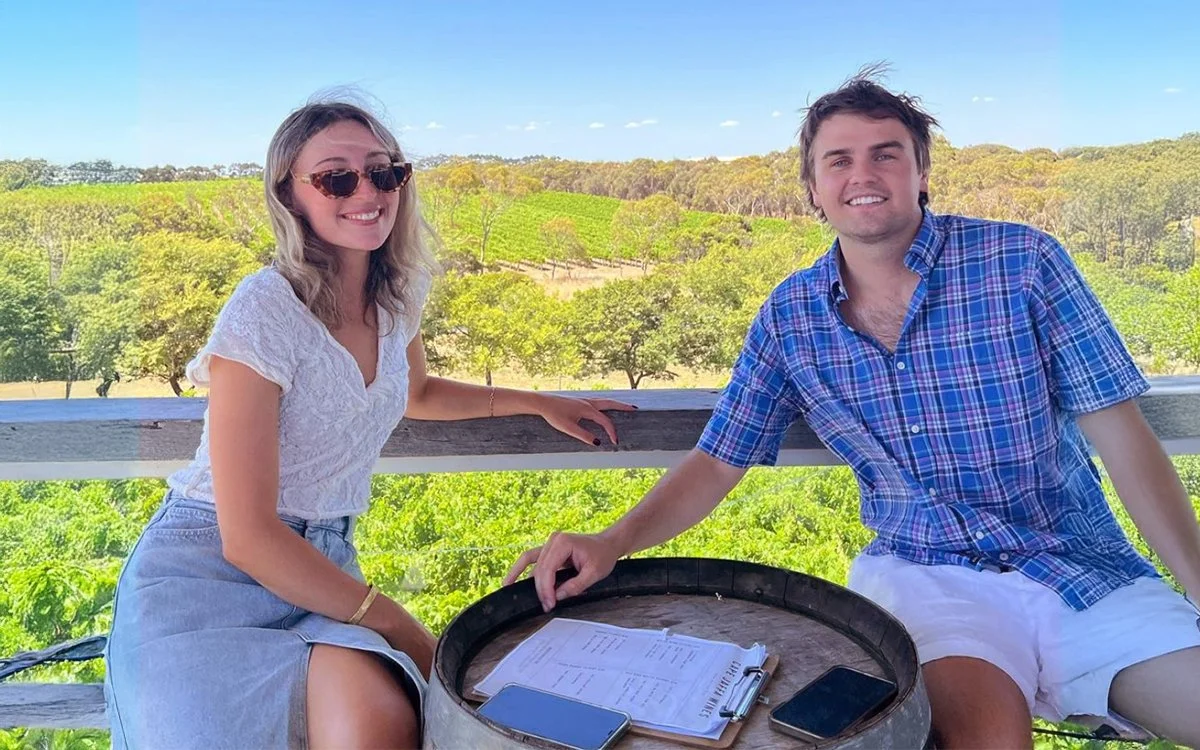 Couple enjoying the vineyard views from Cape Jaffa Wines' covered deck — a unique winery venue with onsite accommodation, brewery access, and a relaxed wedding hire option.