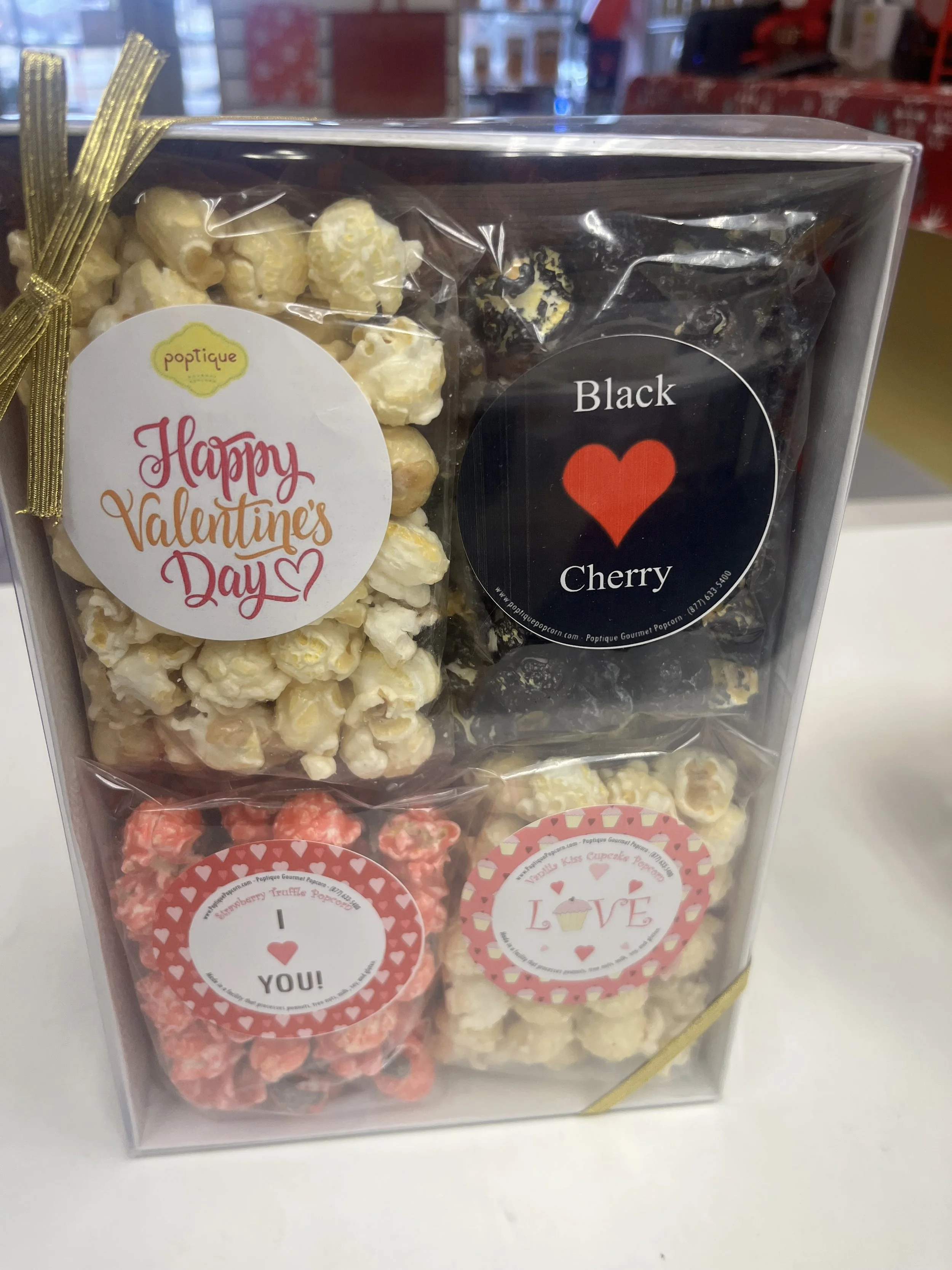 Adorable Valentine Love Sampler with 4 flavors of gourmet popcorn, clear lid display box and ribbon bow