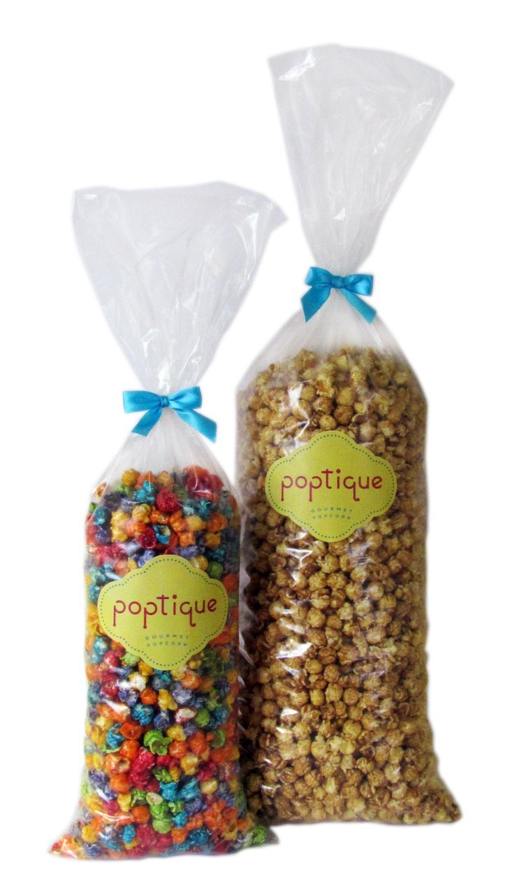 Two clear plastic bags of popcorn with blue ribbon ties and green and yellow labels, one bag contains colorful coated popcorn, the other contains caramel popcorn.