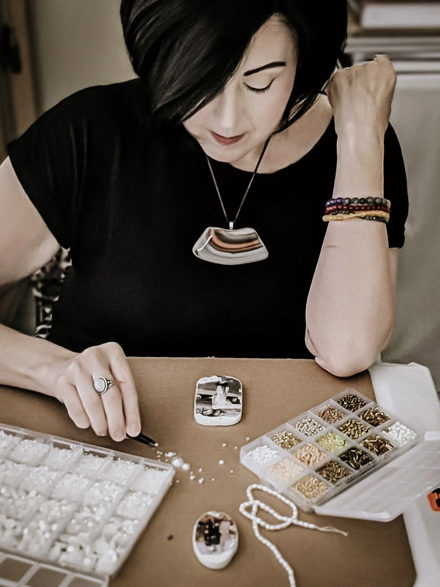Artist Adding Bead Work to Clay