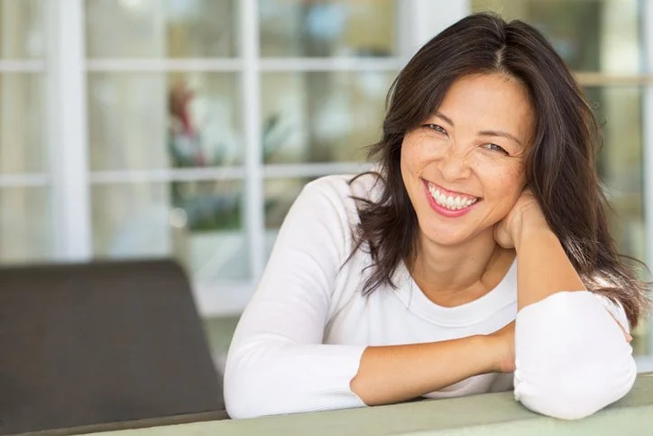 This is a picture of an asian-american woman who is at ease. This picture represents the women that Jessika Fruchter LMFT work with in her practice for midlife women and with women with ADHD.