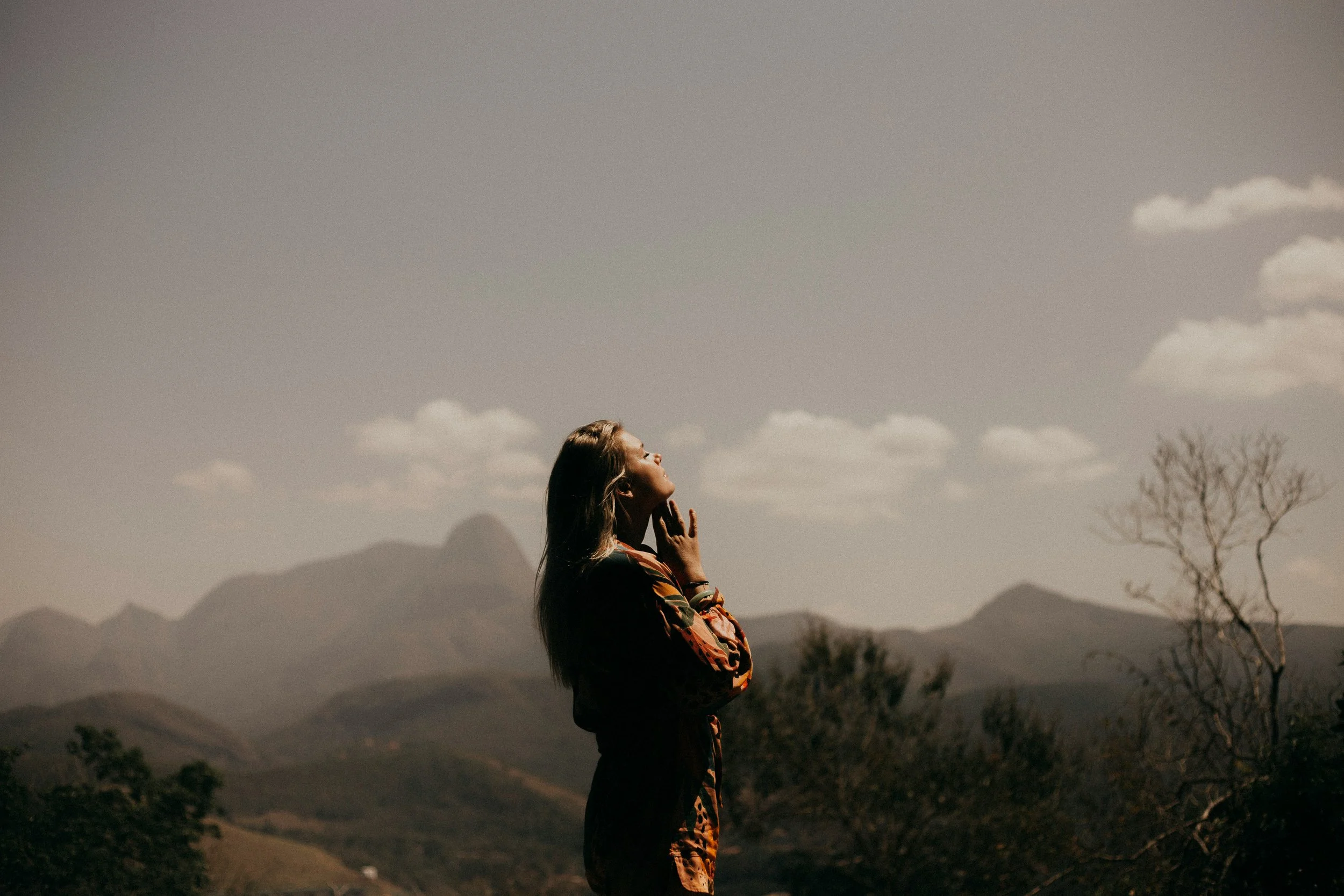 This is a woman in nature feeling connection to something greater than herself. This image represents how Spiritual and Existential therapy can support women who are are wondering about their purpose and what they believe.