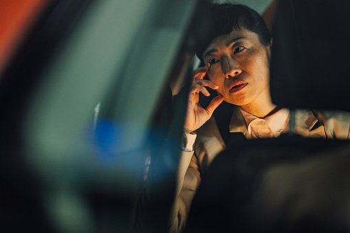 Asian American woman staring off into the distance. Jessika Fruchter LMFT supports women in midlife transition and in midlife crisis to feel better.