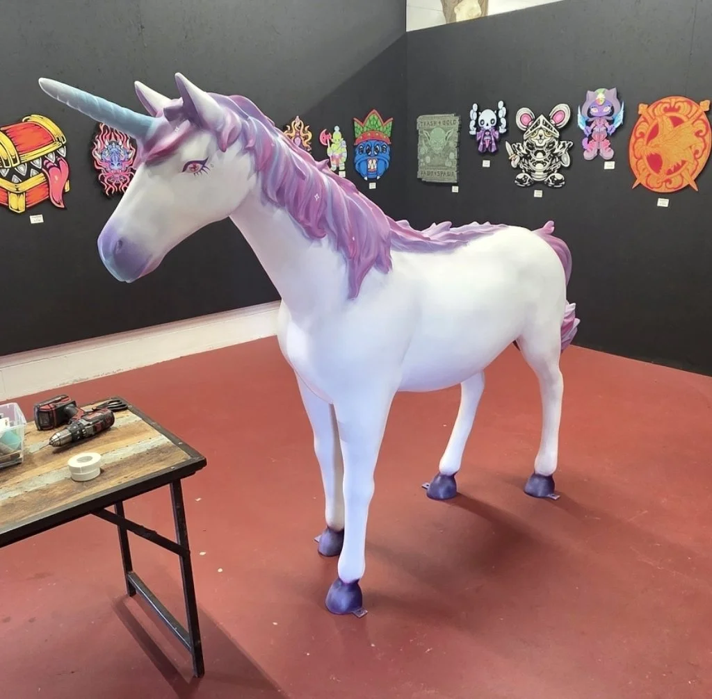 A magical unicorn! Made of plastic, customized colors and design by local artists