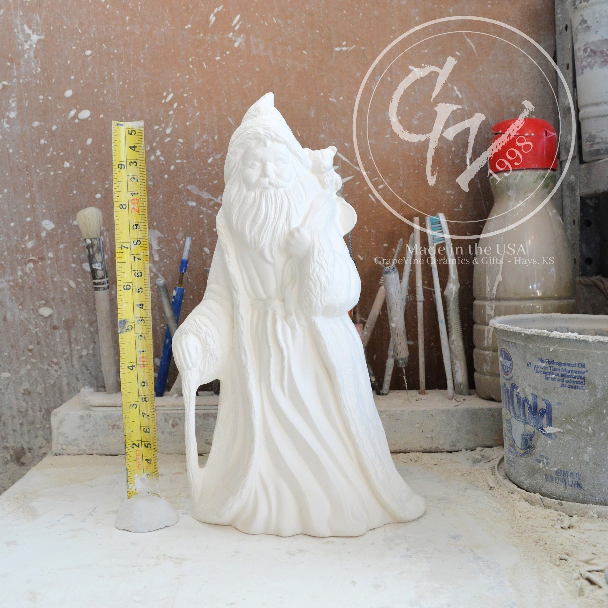 Rare 10-inch unpainted French Santa ceramic bisque with a hooded cloak and vintage Old World features.