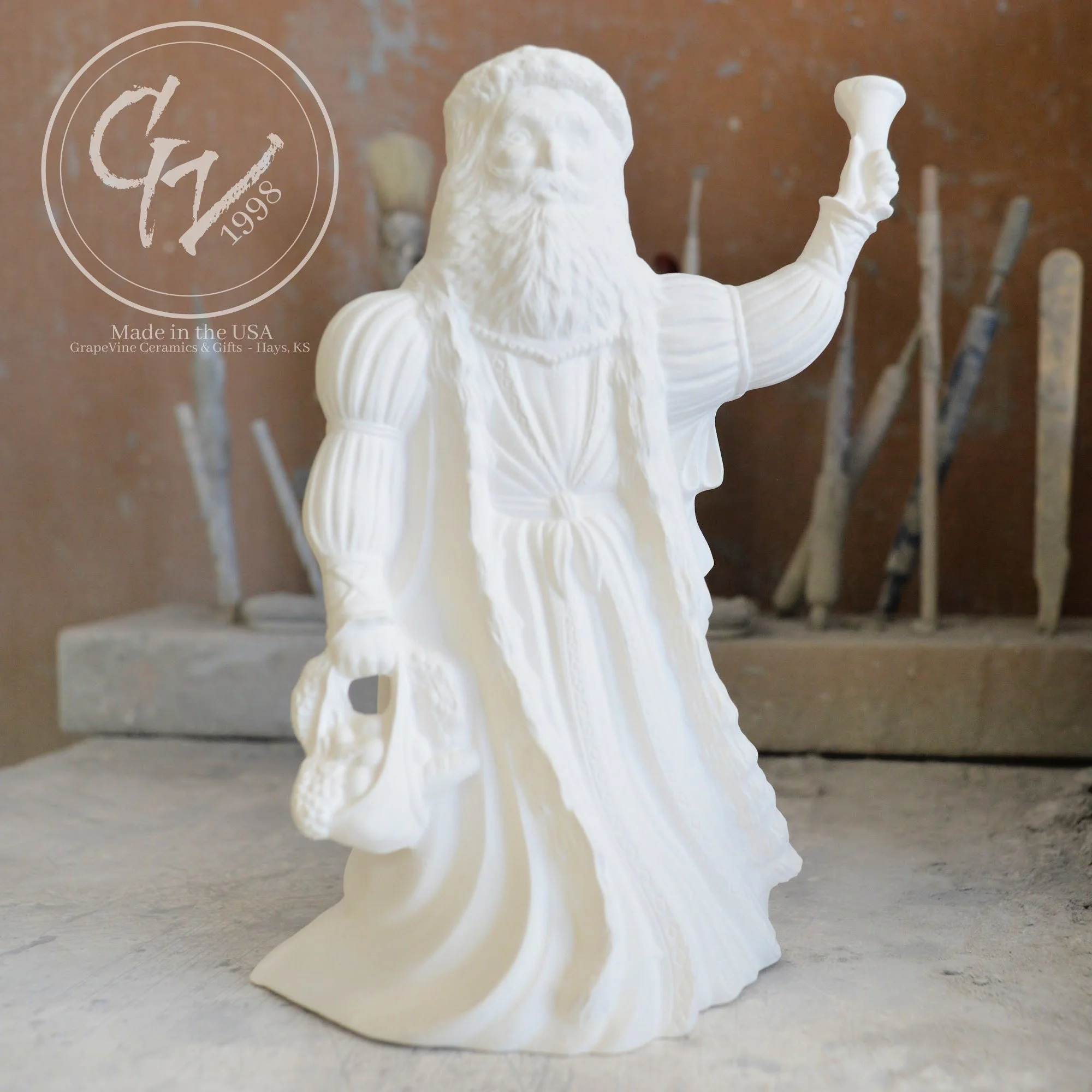 Small unpainted English Santa ceramic bisque figurine, 6 inches tall, featuring a traditional long robe and staff.