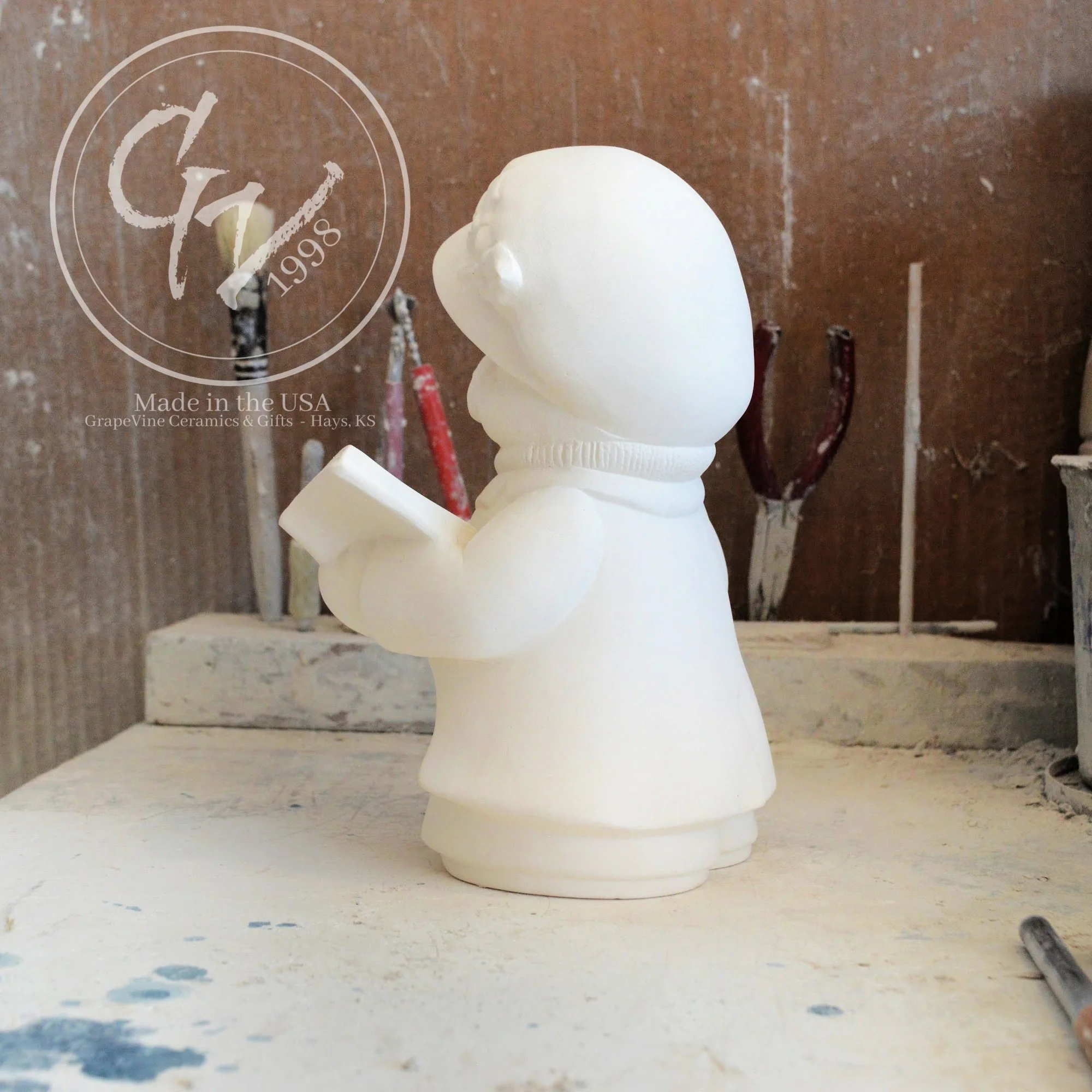 7.5-inch unfired ceramic bear showing smooth, hand-cleaned surfaces ready for painting.