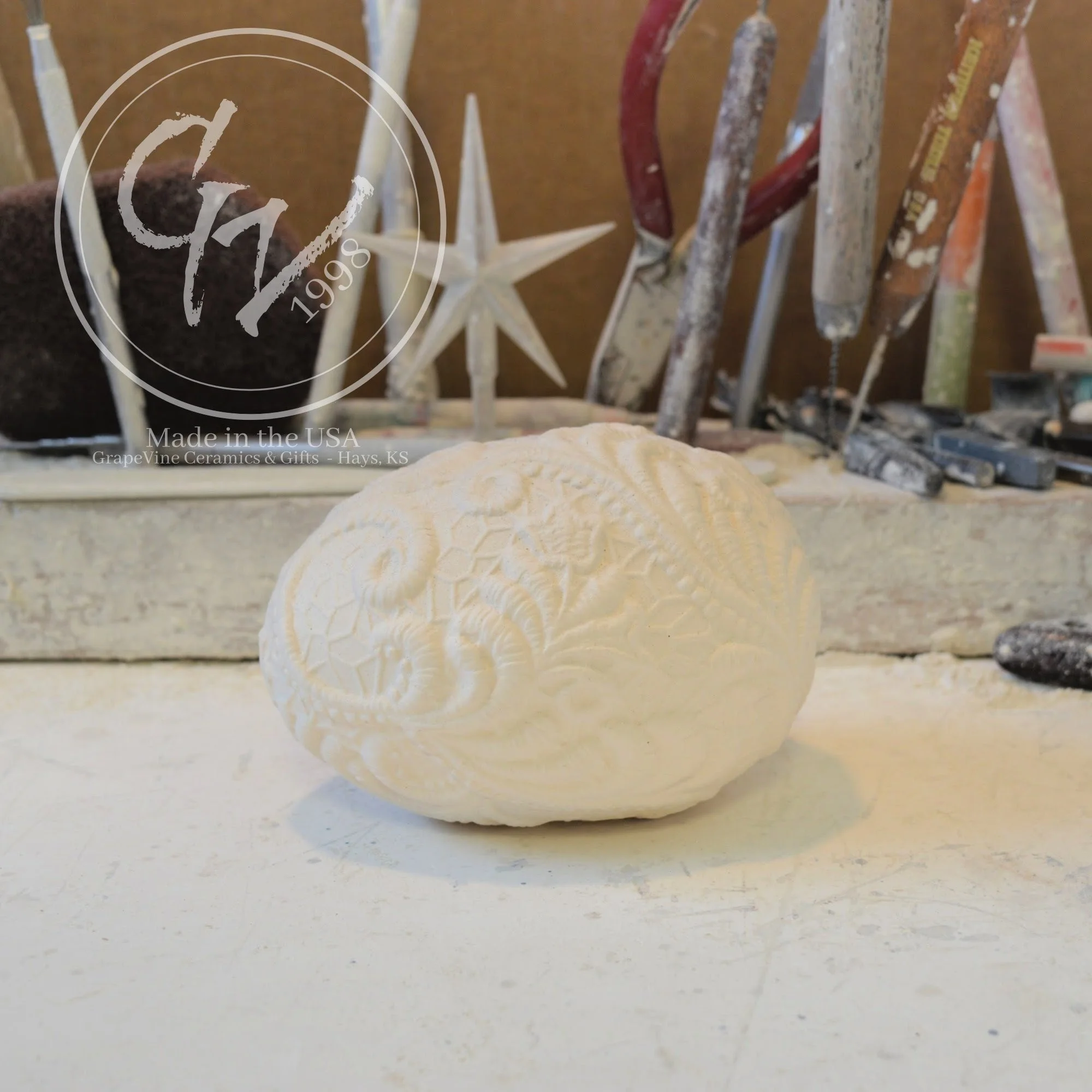 Ready-to-paint resting lace duck egg ceramic bisque with detailed lace texture for Easter decorating and DIY painting projects