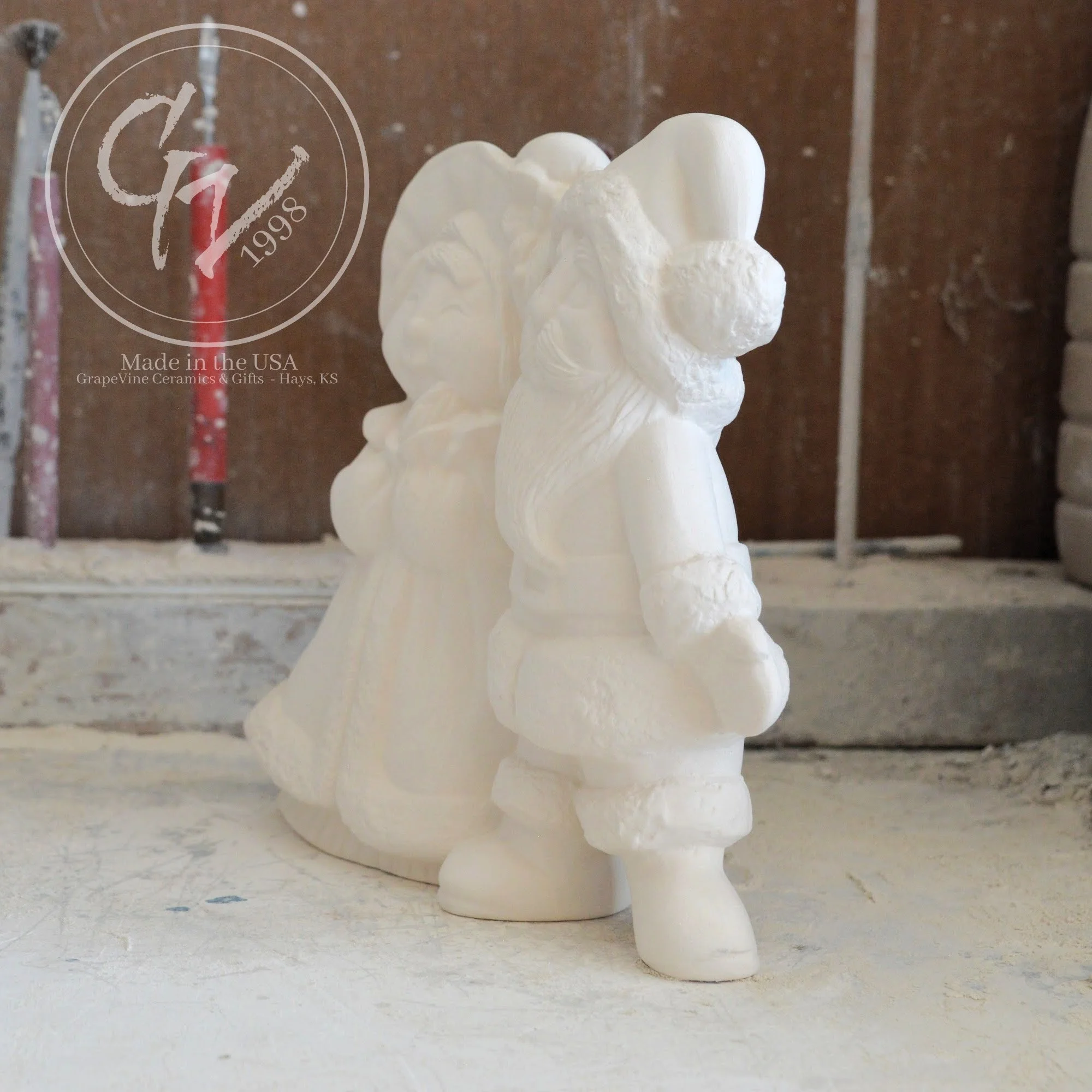 Side profile of smooth, professionally cleaned white ceramic Santa figurines ready for acrylic paint or kiln glazing.