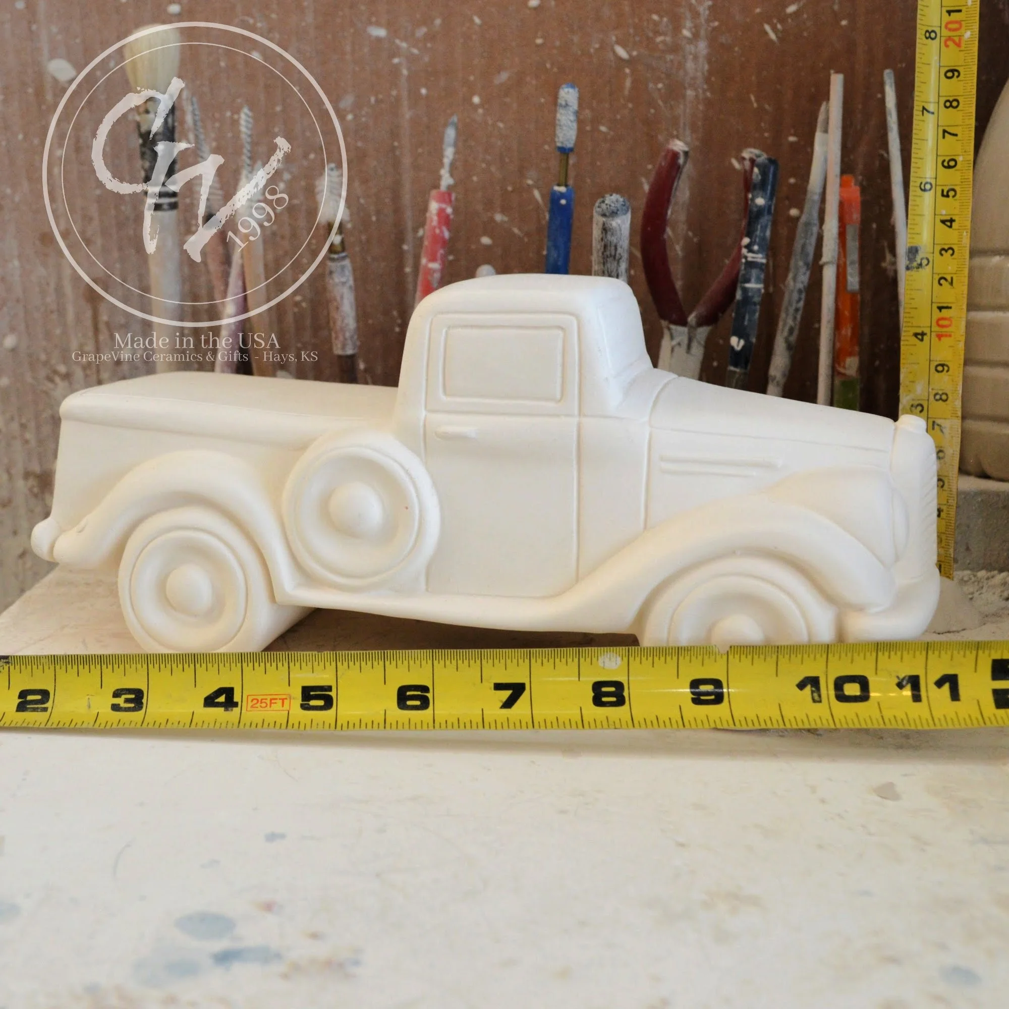 Unpainted white ceramic jalopy pickup truck bisque, Clay Magic 4208 with tape measures for scale, ready for DIY painting.