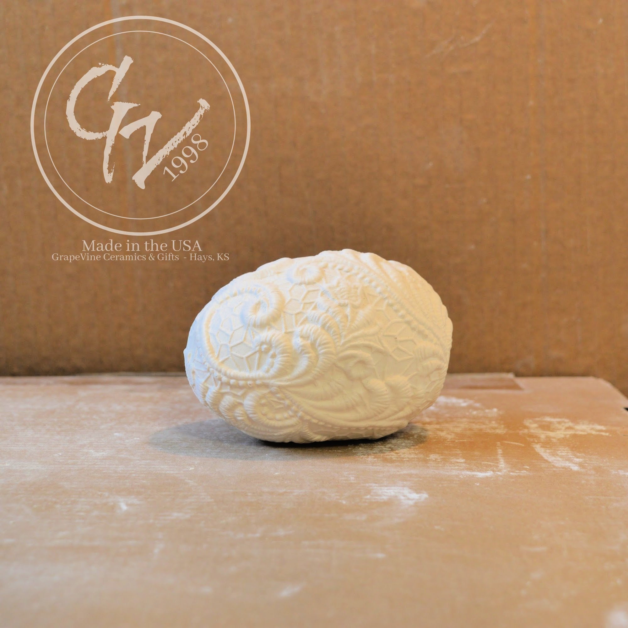 Ready-to-paint resting lace duck egg ceramic bisque with detailed lace texture for Easter decorating and DIY painting projects