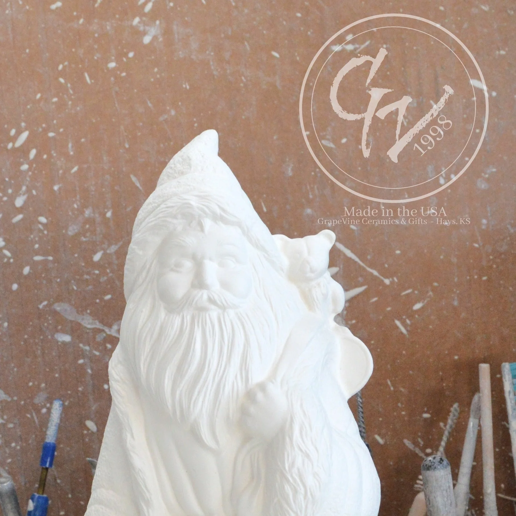 Close-up of the intricate fur-lined hood and facial details on a high-quality French Père Noël ceramic mold.