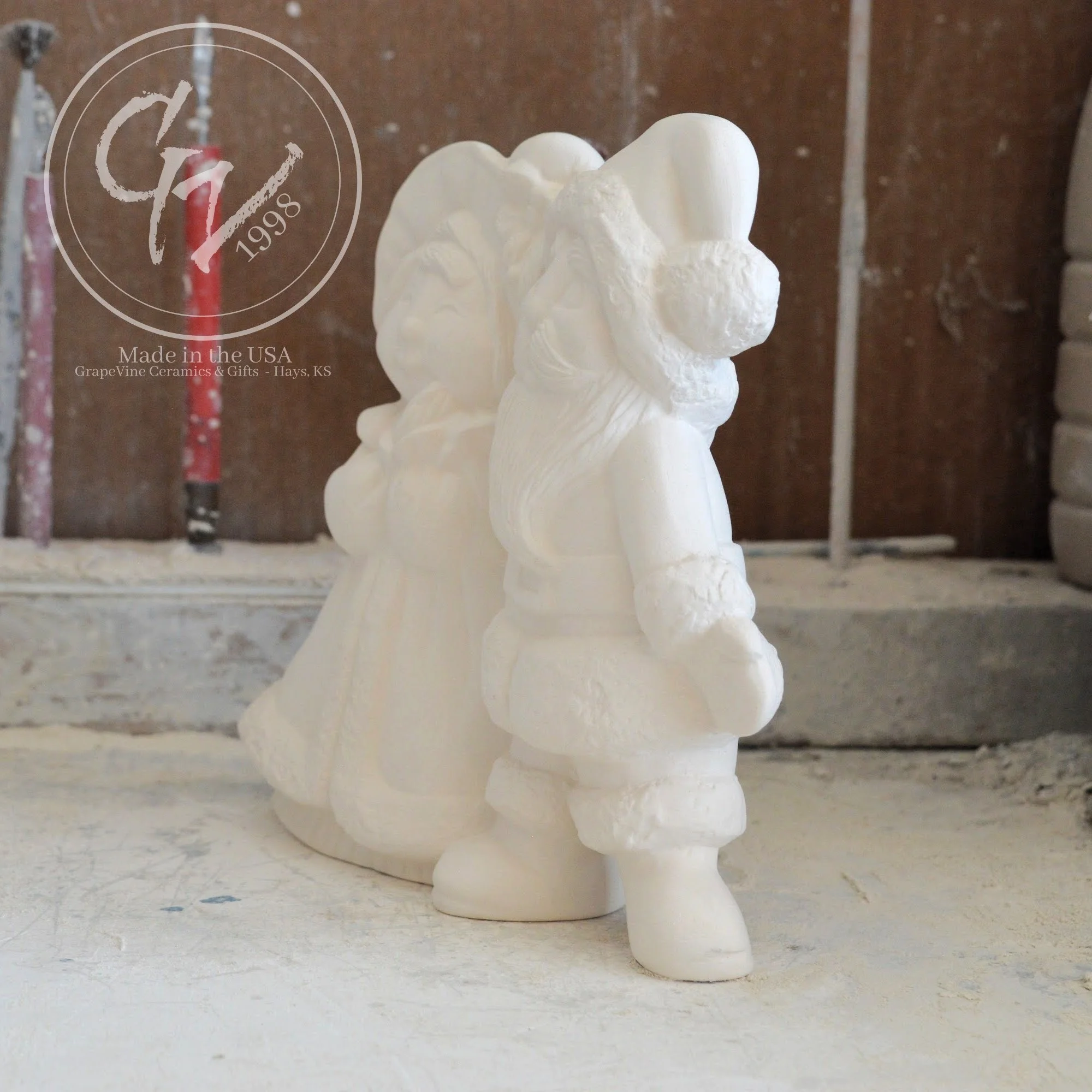 Side profile of smooth, professionally cleaned white ceramic Santa figurines ready for acrylic paint or kiln glazing.